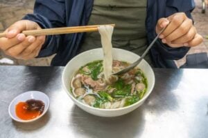 Instant Pho Bowl: Quick Comfort Food at Your Fingertips! 1 (eating an instant pho bowl)