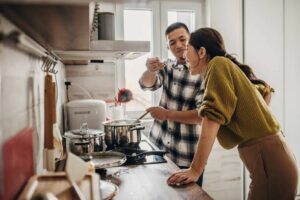 From Kitchen to Table: How to Make Pho at Home! 1 (man spoonfeeding a woman what he just cooked)