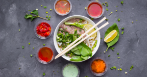 How to Make Vietnamese Beef Pho – A Delicious, Traditional Recipe to Try Today 4 beef pho with herbs and dipping sauces