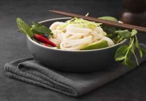 What Are Bean Thread Noodles? A Light and Versatile Favorite in Vietnamese Cooking 3 Bowl of bean thread noodles with chopsticks, showcasing a light and nourishing meal option.