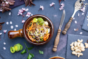 Is Pho High in Cholesterol? Here’s What You Should Know 3 Flat lay of pho noodles with spoon and light broth, highlighting VIFON instant pho option.