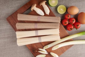 What Is Pho Noodles Made Of? The Secret Behind Vietnam’s Signature Dish 1 Flat rice noodles before cooking, the main ingredient used to make Vietnamese pho.