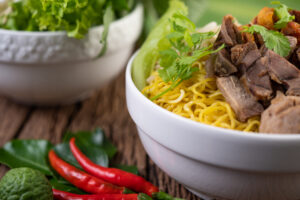 Is Pho High in Cholesterol? Here’s What You Should Know 1 Vietnamese pho bowl with rice noodles, clear broth and fresh herbs showing a balanced, nourishing meal.