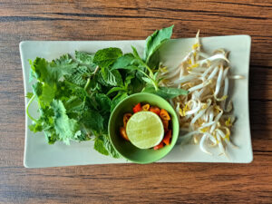 Does Pho Have a Lot of Sodium? What You Should Know 2 Fresh pho herbs and garnishes.