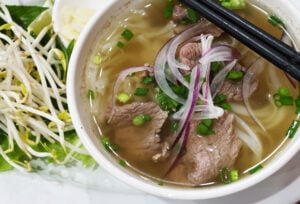 What Is Tendon in Pho? Understanding This Traditional Ingredient 2 Beef pho with herbs and bean sprouts.